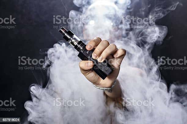 Girl soars on a black background vape